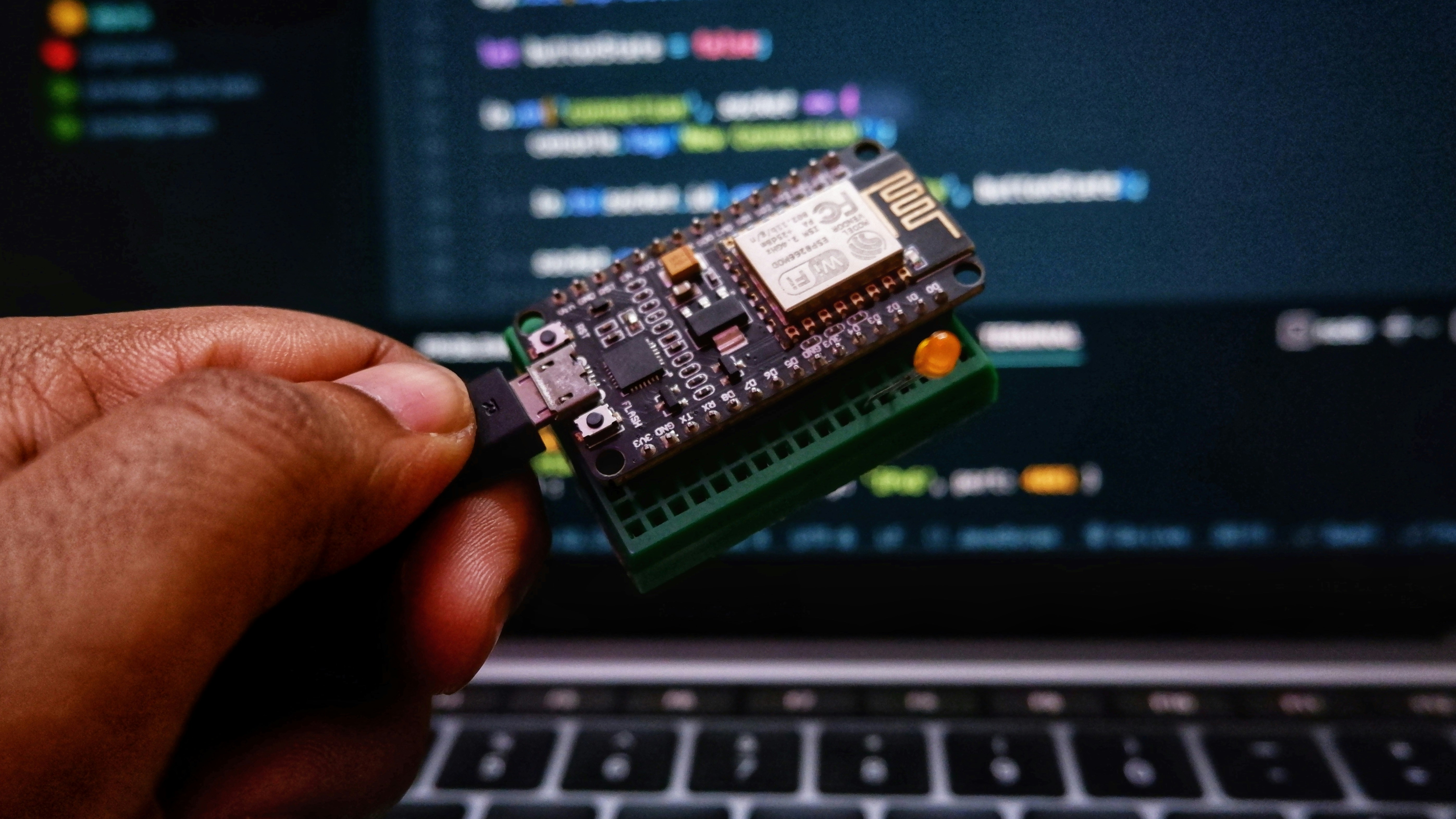 Engineer working with a connected microcontroller